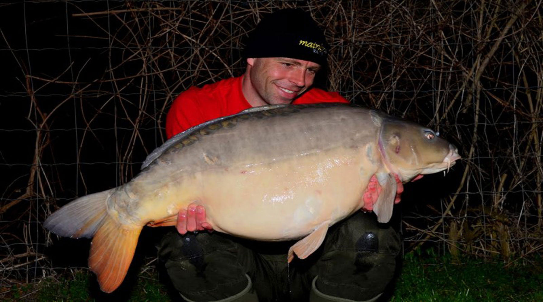 Dean Macey with a stunning French Mirror Carp